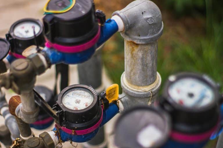 A collection of water meters and valves displayed together, representing The Water Meter Guys' services and products.